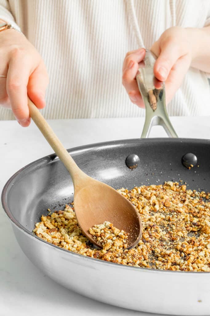 A picture of frying almond 'bread' crumbs until golden.