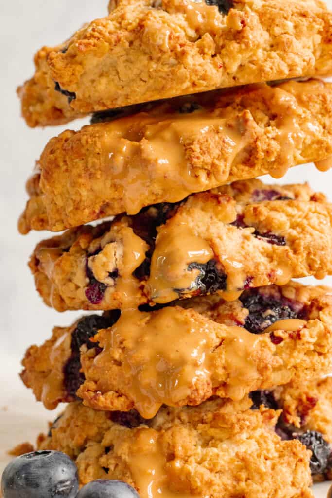 Close Up of Blueberry Crumble Cookies Stacked High with Cashew Drizzle - Vegan, GF & Healthy! Georgie Eats.