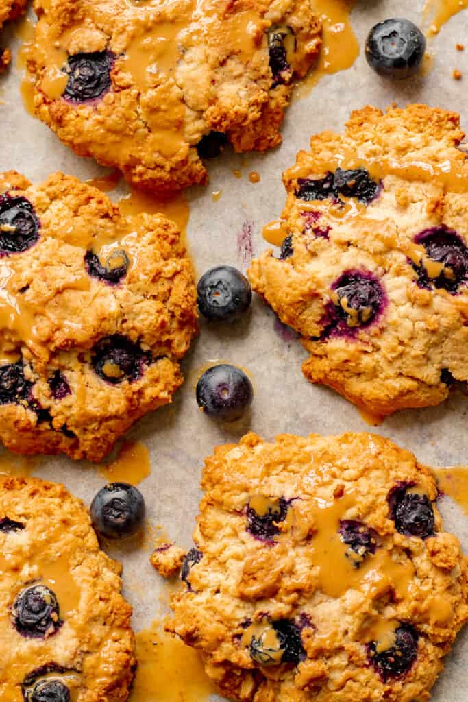 Blueberry Crumble Cookies on Baking Tray with Cashew Drizzle - Vegan, GF & Healthy! Georgie Eats.