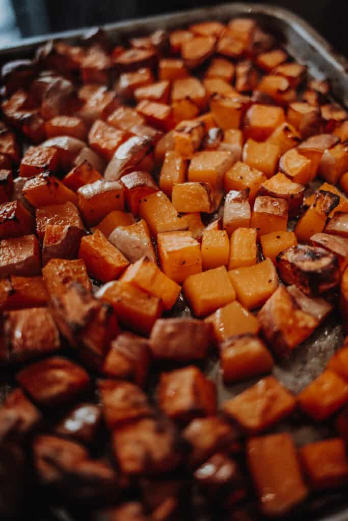 A tray of roasted butternut squash and sweet potato.