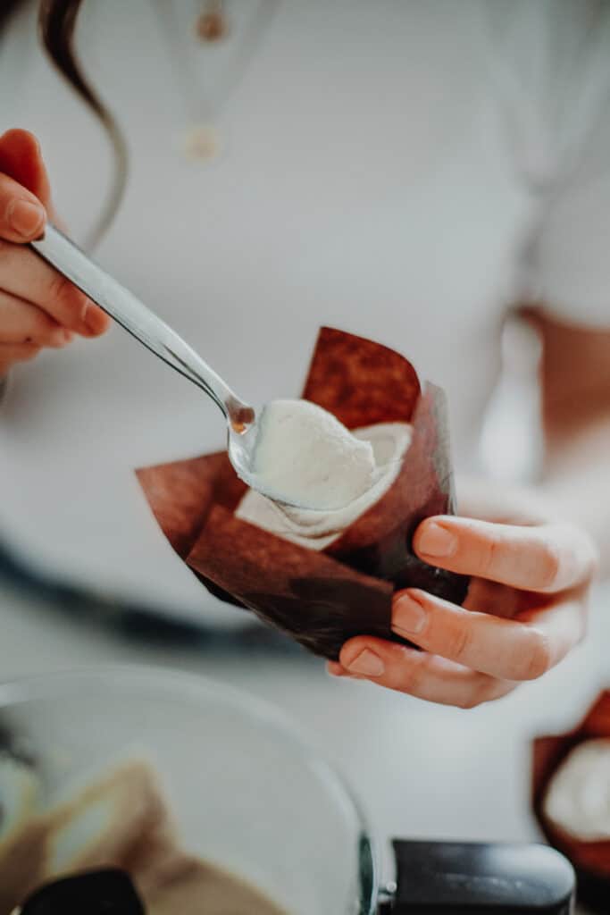 Icing a sweet potato muffin with cashew frosting.