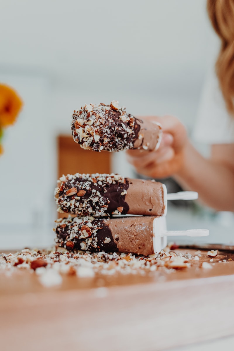 A stack of Chocolate Fudge Ice Lollies - Vegan, gluten-free & healthy! Georgie Eats.