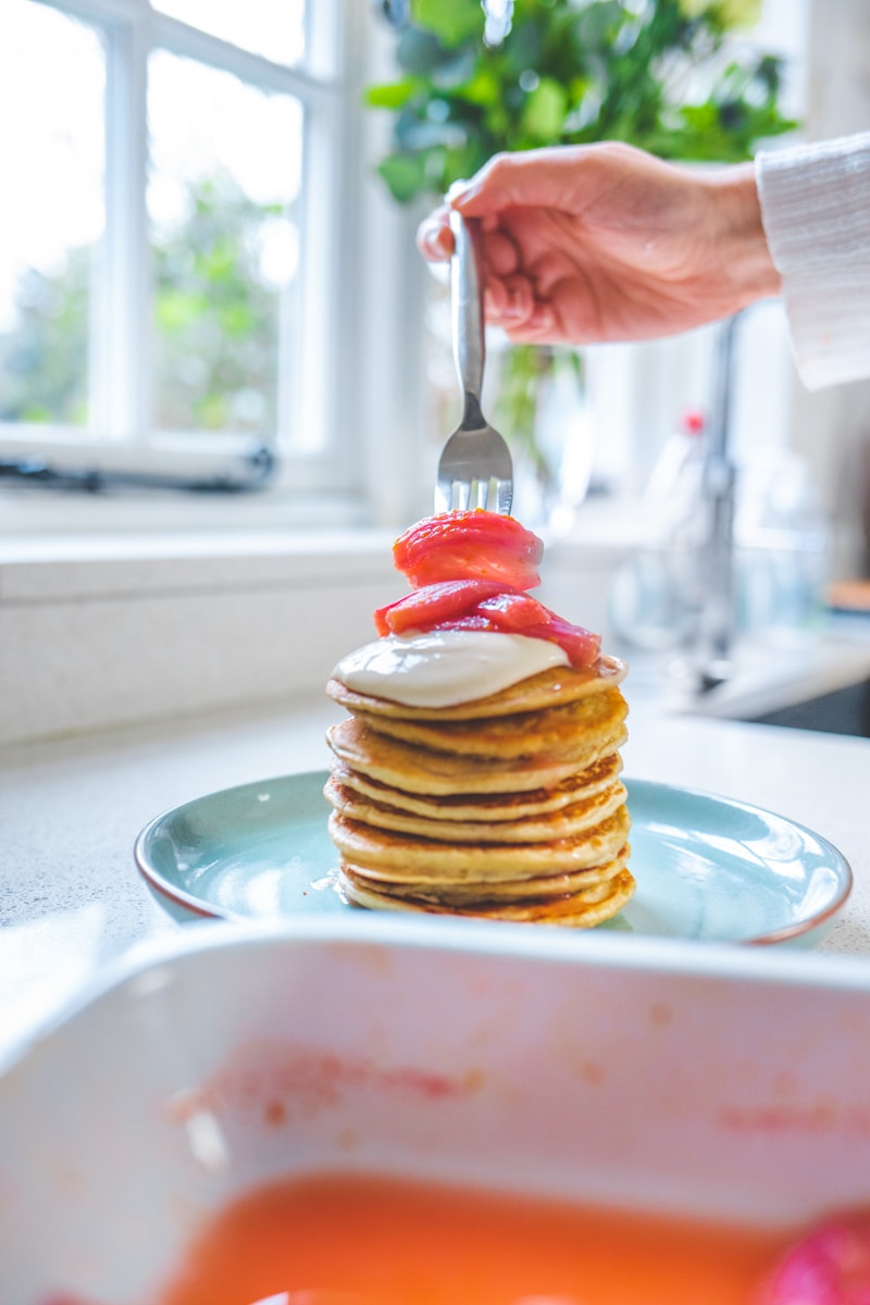 Plating up Vegan Rhubarb & Custard Pancakes - Georgie Eats