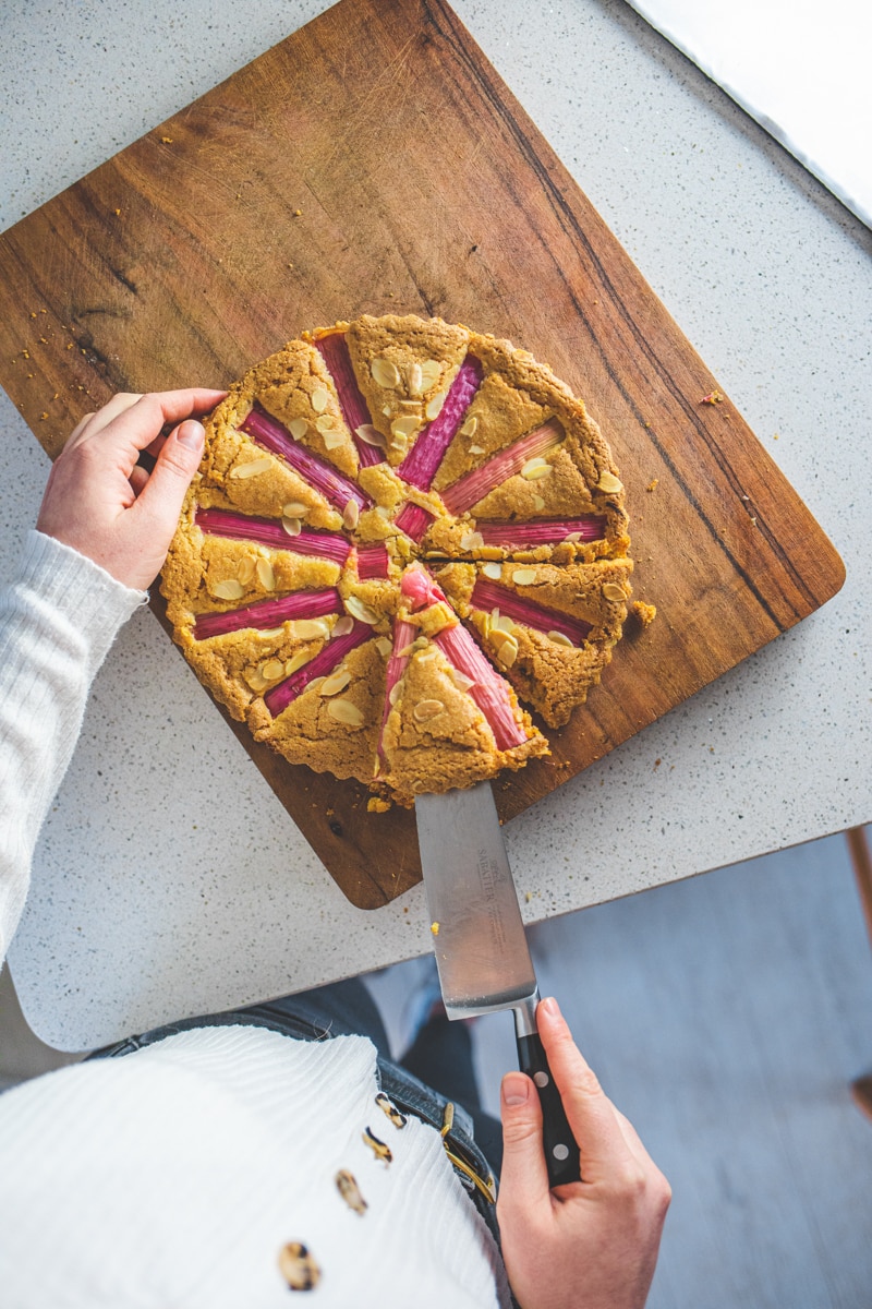 Rhubarb & Ginger Frangipane being cut - Georgie Eats