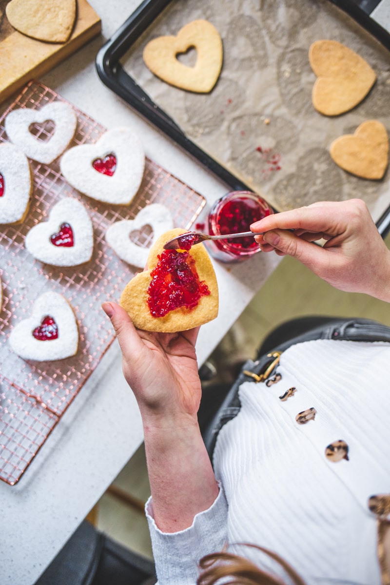 Filling the Valentine Heart Biscuits with Raspberry Jam - Georgie Eats