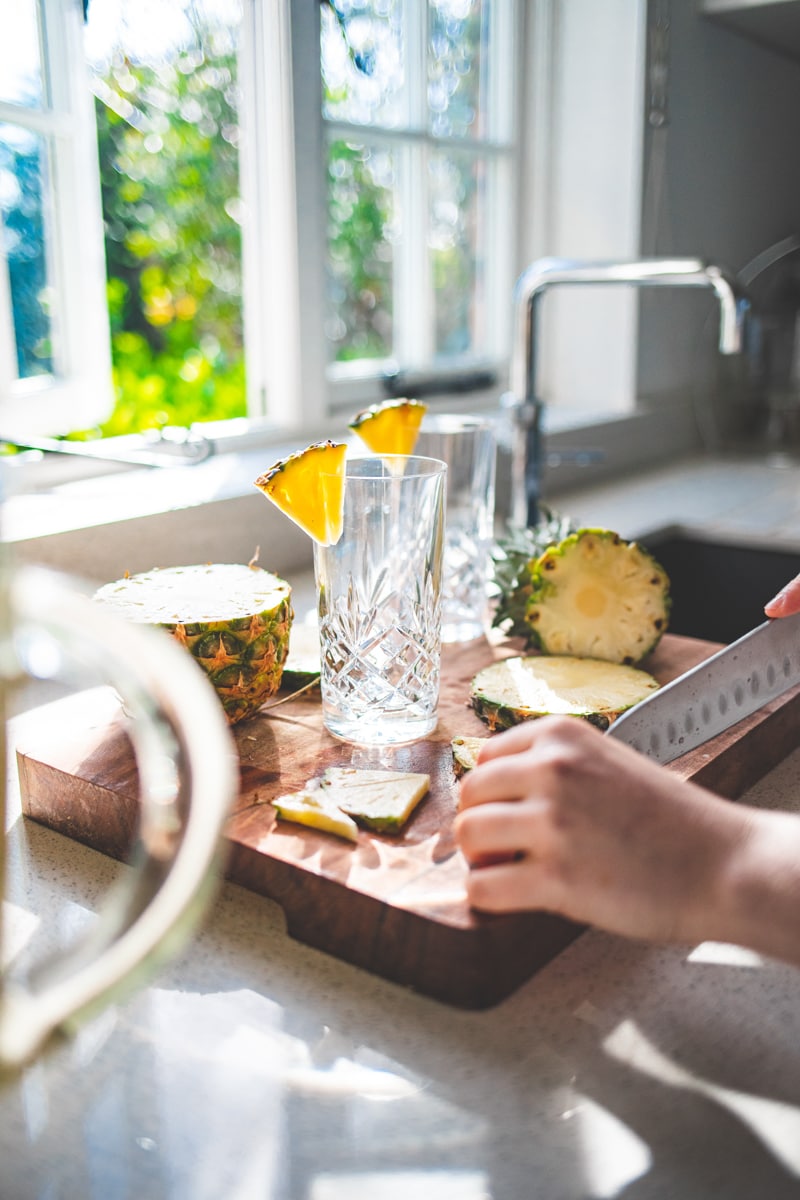 Cutting pineapple for Pina Colada Breakfast Smoothie - Georgie Eats