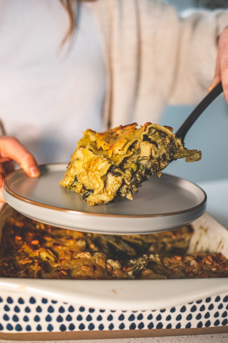 Pesto Lasagne being put onto a plate