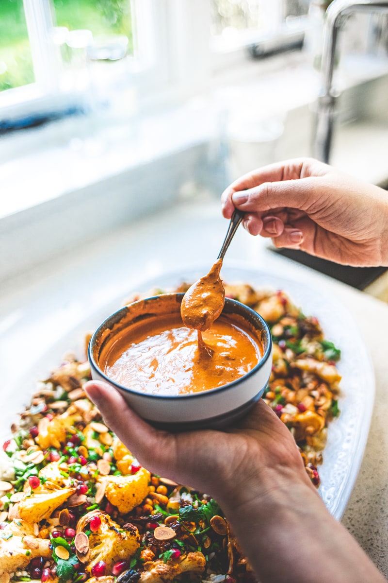 Dressing the Harissa Roasted Cauliflower Salad - Georgie Eats