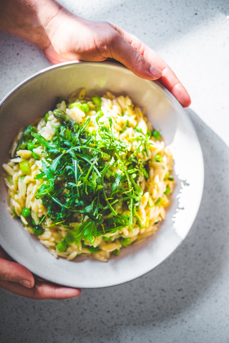 Asparagus & Pea Orzotto in a bowl - Georgie Eats