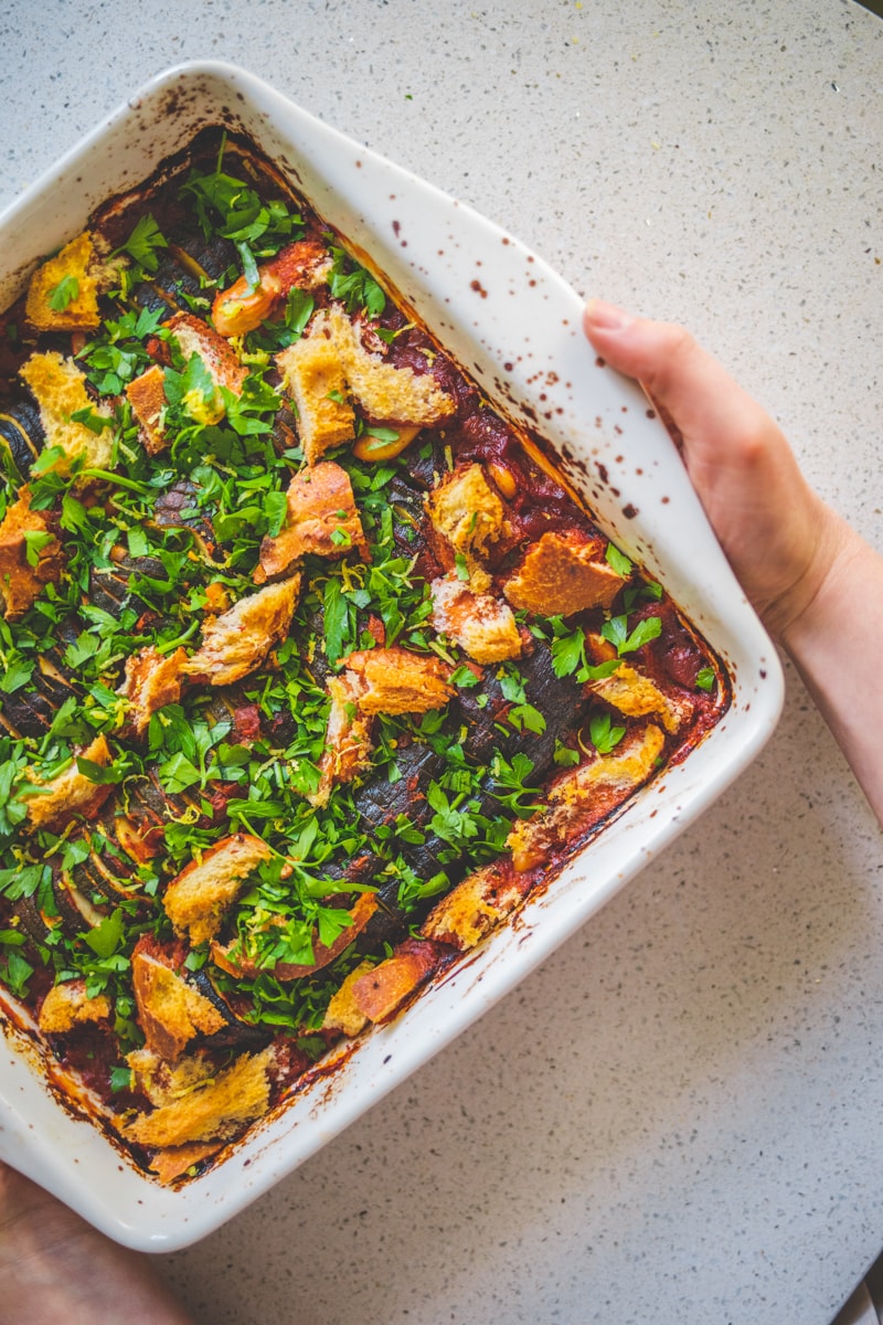 a dish of Hasselback Courgette Bake with Harissa & Croutons - Georgie Eats