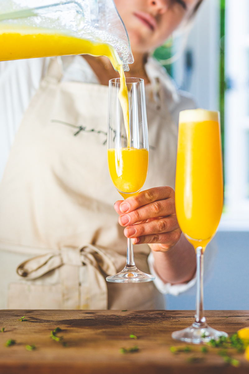 pouring the Frozen Peach Bellinis - Georgie Eats