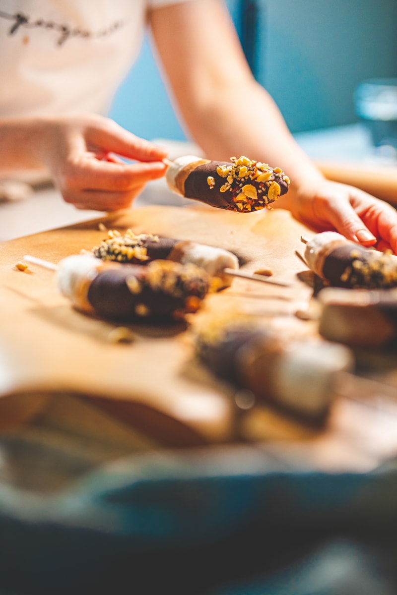 lifting Healthy Snickers Ice Pops from a tray - Georgie Eats