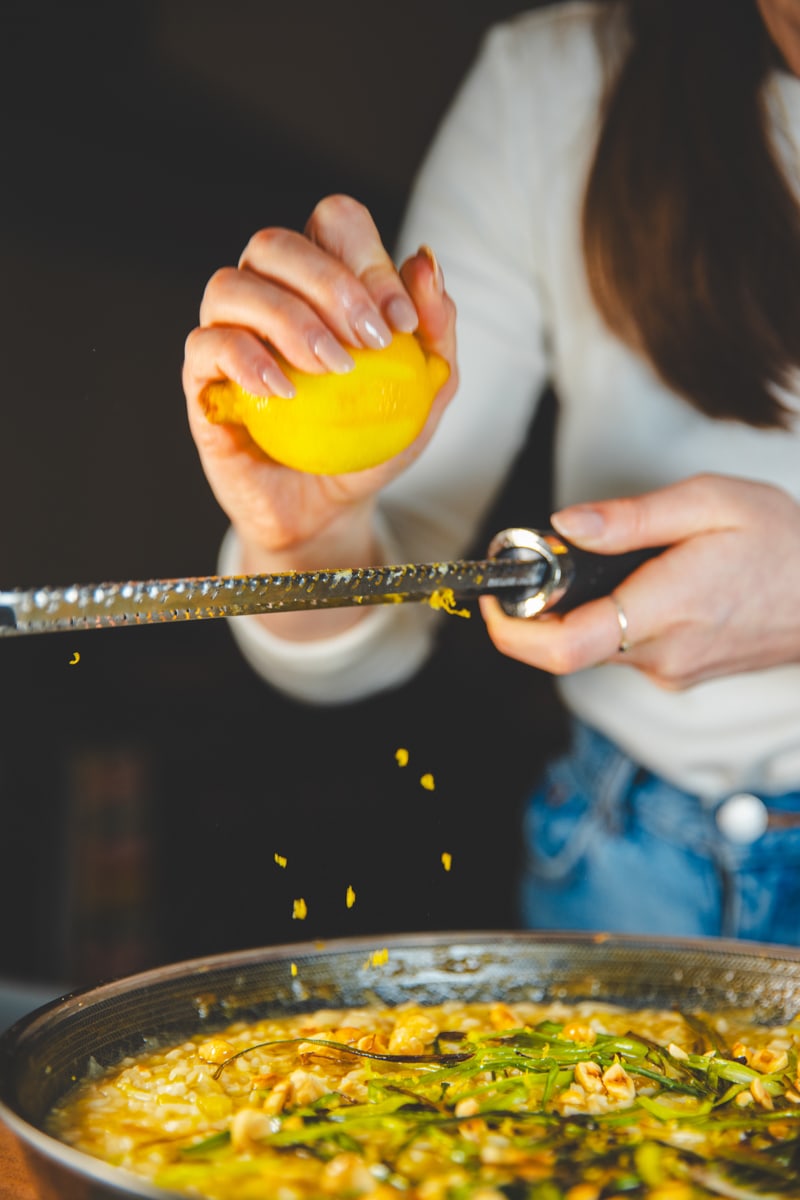 Grating lemon on the Whole Leek Risotto - Georgie Eats