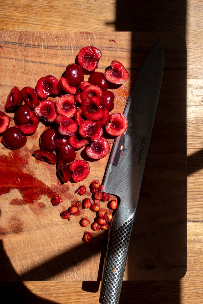 Cherries cut on a board | Georgie Mullen